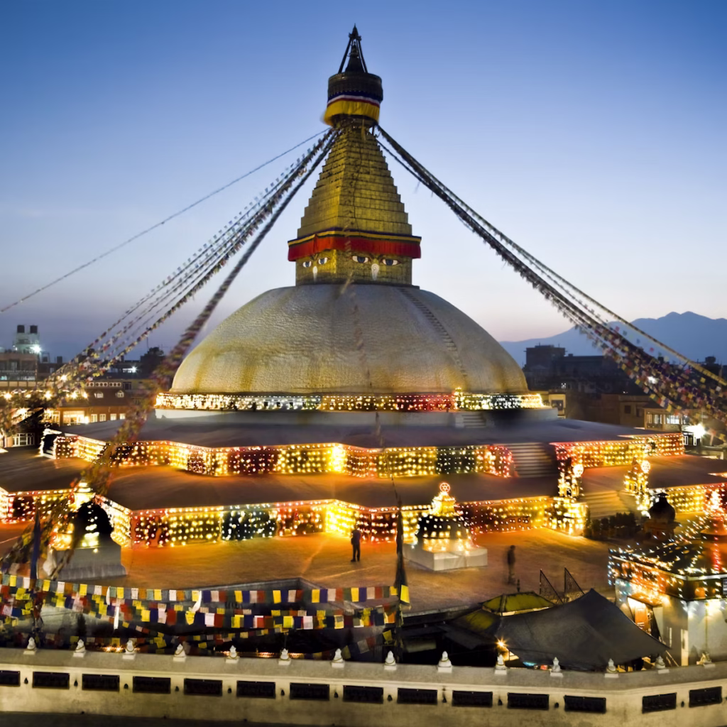 Chabahil Stupa, also known as Dhando Chaitya, an ancient Buddhist stupa in Kathmandu, Nepal, featuring a white dome, gilded spire, and prayer flags, surrounded by historic and urban surroundings.