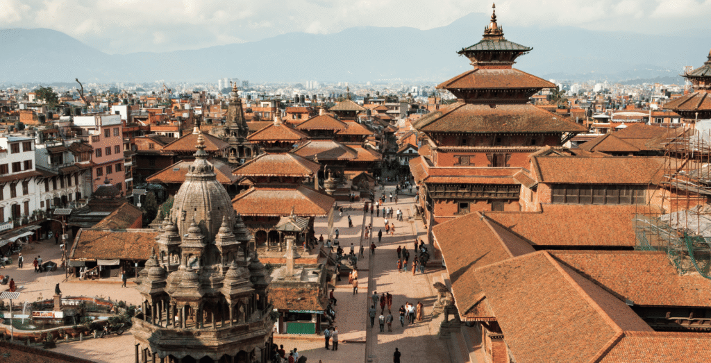 Patan Durbar Square, a historic UNESCO World Heritage site in Lalitpur, Nepal, featuring exquisite Newari architecture with ancient temples, palaces, ornate wood carvings, and vibrant local culture.