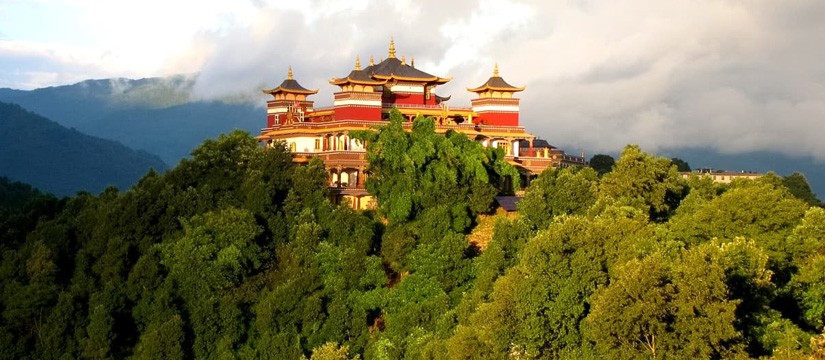 Kopan Monastery, a peaceful Tibetan Buddhist monastery in Kathmandu, Nepal, perched on a hilltop with views of the valley, prayer flags fluttering, and monks engaged in daily rituals and meditation.